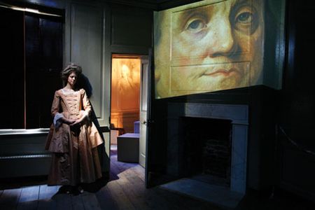 Actress Meg Faragher as Polly Stevenson Hewson, the daughter of Franklin's landlady, guides visitors through a high-tech presentation dramatizing Franklin's London years.