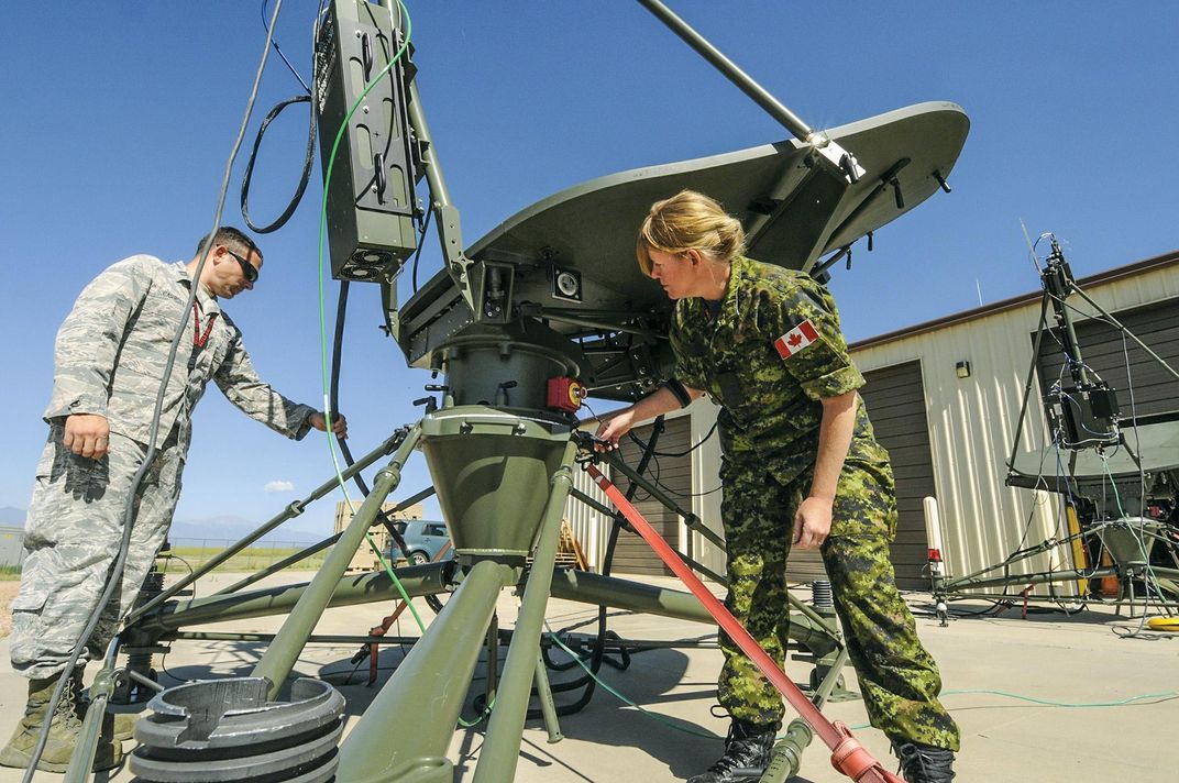 technicians set up antennas