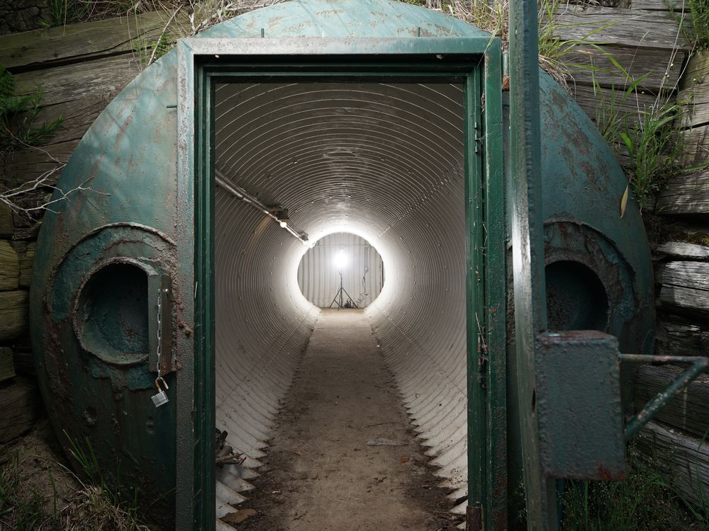 Door to JFK's Nantucket nuclear fallout shelter, with long corridor visible in the distance