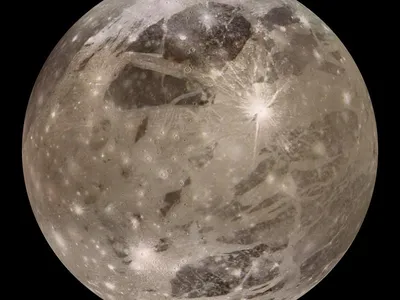 Jupiter's moon Ganymede is the largest moon in the solar system and is even wider than the planet Mercury.