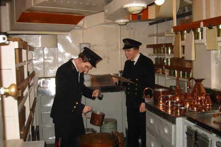 This diorama shows a sailor receiving his "daily tot." It was even mixed according to custom: on a "scuttled butt" with an officer overseeing the mixing.