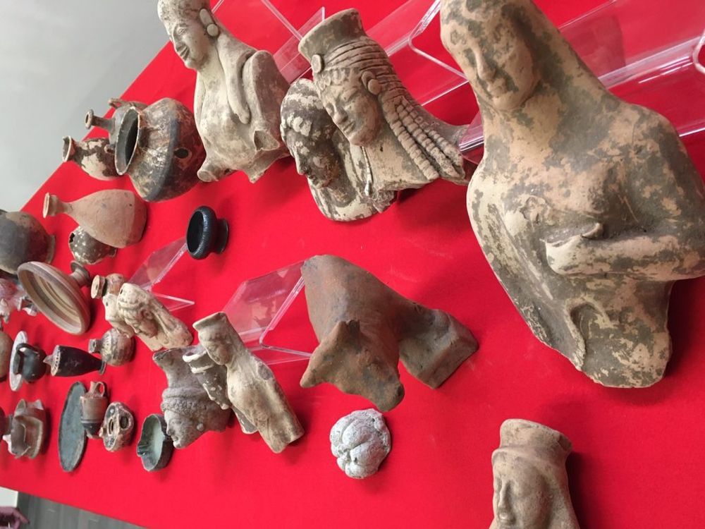  A variety of stolen Japanese artifacts, including pottery, figurines, and masks, that were found in an attic in Massachusetts.