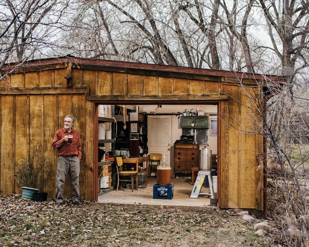 Charlie Papazian outside his current brewery—the detached garage of his home near Boulder, Colorado. He grows his own hops in a field nearby.