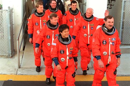 Glenn and his shuttle crewmates preparing to board Discovery in 1998.