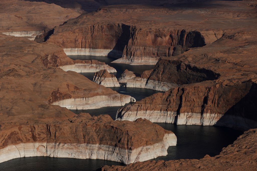 In this aerial view, The tall bleached "bathtub ring" is visible on the rocky banks of Lake Powell on June 24, 2021 in Page, Arizona.