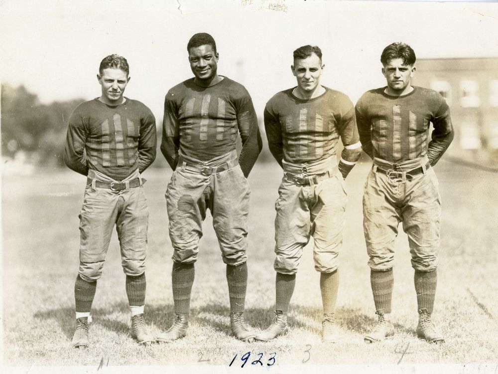 Jack Trice (second from left) and three of his teammates on the varsity football team