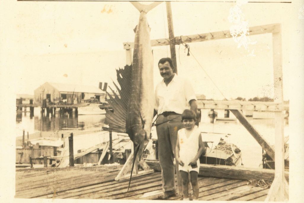 Ernest Hemingway and his middle son, Patrick, pose with a record 119.5-pound Atlantic sailfish caught off Key West, Florida, in May 1934.