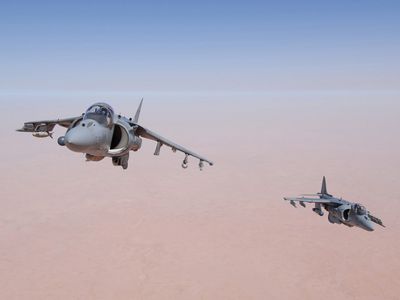 Aviators of Marine Attack Squadron 23—the "Ace of Spades"—based out of Cherry Point, North Carolina maneuver their AV-8B Harriers for an aerial refueling mission high above Iraq's Al Anbar Province. 