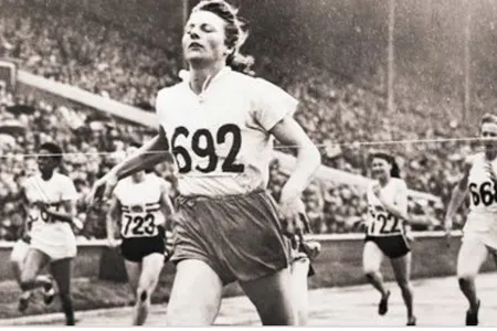 Fanny Blanker-Koen crosses the finish line to become the first triple champion of the 14th Olympic Games.