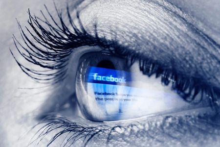 For now, visually impaired people must rely on captions like these for descriptions of the images on the internet. (This is a picture of an eye reflecting Facebook's home page). 