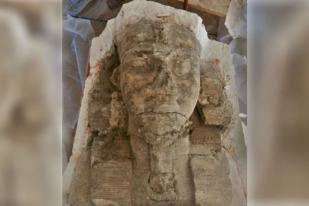large stone head of man with egyptian headress