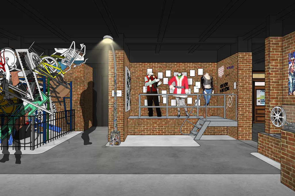 An exhibition with brick walls featuring costumes and designs from "Rent"
