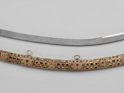 Turkey, before 1656.  Used by the czar during military processions and inspections, this saber of the Grand Attire is a remarkable work.  The finest jewelers associated with the Ottoman court created the saber and scabbard.  The blade contains an Arabic inscription, which reads, “May you pass your time in bliss.”