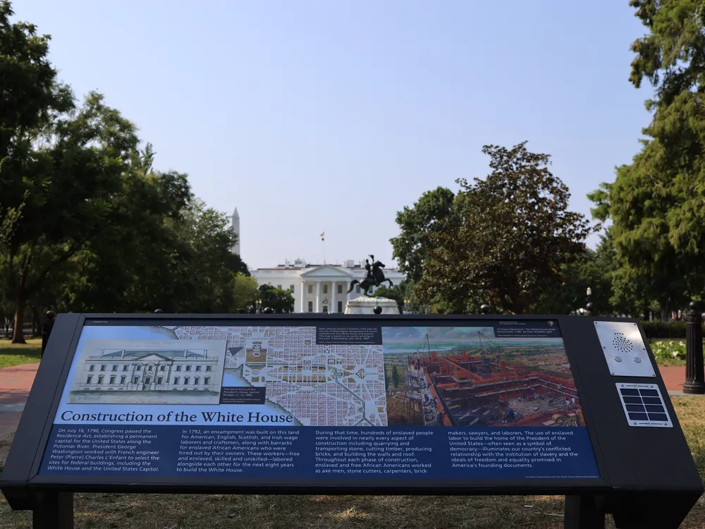 A view of the informational plaque, which features an image of the White House construction plans and the quarries used to obtain materials