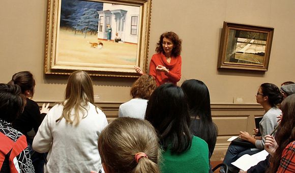 Teaching artist Mary Hall Surface stands in front of Edward Hopper’s 1939 painting Cape Cod Evening at the National Gallery of Art. Surface will lead a creative writing workshop for Smithsonian Associates at the Freer Gallery of Art on March 27. 