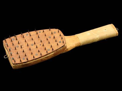 A wooden paddle with a nail-studded leather face was used in Alabama in 1899 to perforate mail in preparation for fumigation as a precaution against yellow fever.