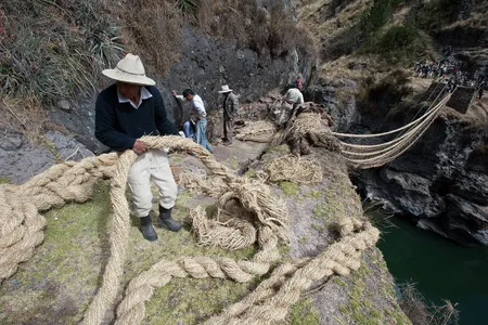 Villagers construct a new bridge over the Apurimac River, in Huinchiri, Peru, in 2012. 