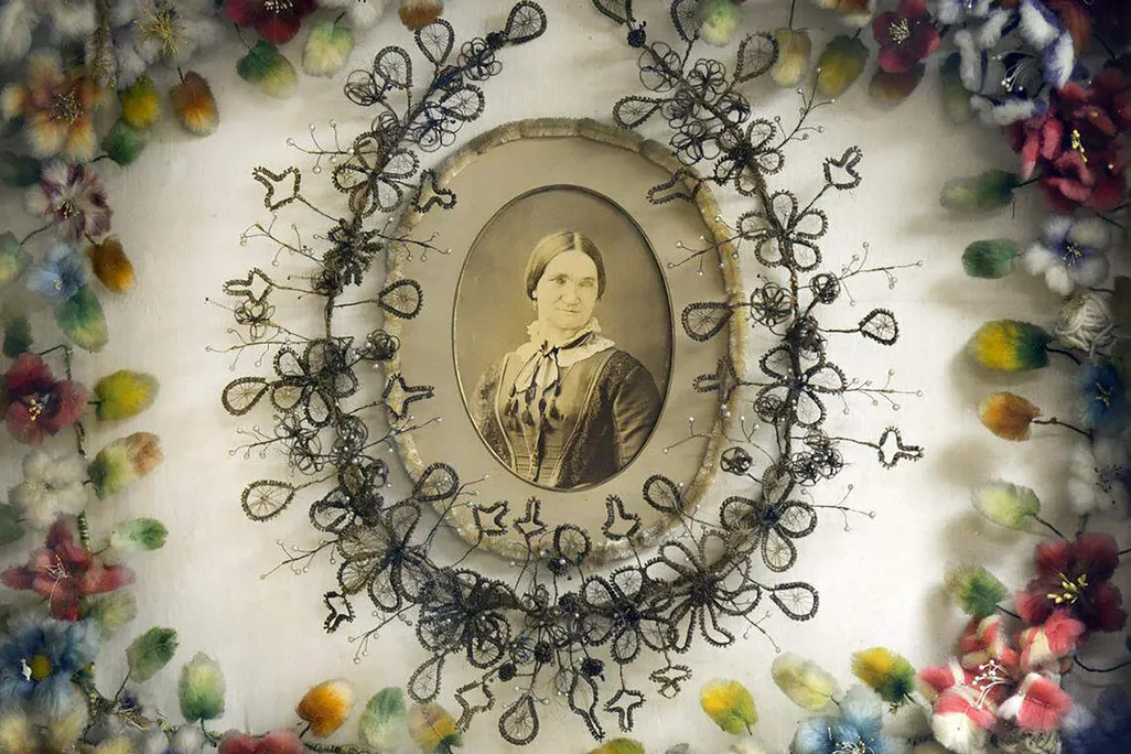Portrait surrounded by woven-hair flowers