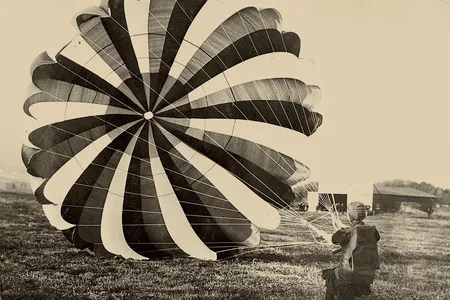 Tiny Broadwick, the first woman to jump from an airplane, handles her wind-filled canopy after a safe landing. She made 1,000 jumps between 1907 and 1922. In 1964, she was made an honorary member of the 82nd Airborne Division at Fort Bragg, North Carolina.