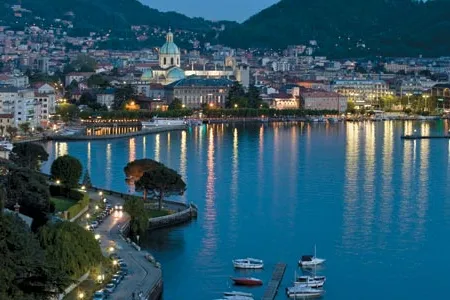 Set like a jewel on the edge of Lake Como, the city of Como (its shoreline at dusk) is not just a tourist mecca but also an important center of the country’s silk industry, providing high-quality goods to the fashion houses of New York City, Paris and Milan.