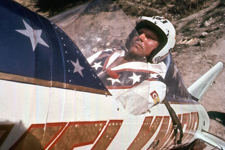 Evel Kneivel shown here in this promotional still from the 2015 documentary Being Evel, about to launch in the Skycycle X-2, a steam-powered rocket, wearing a helmet, of course. 