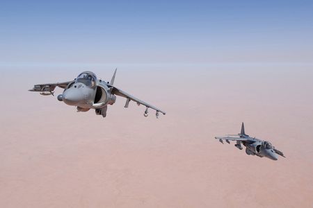 Aviators of Marine Attack Squadron 23—the "Ace of Spades"—based out of Cherry Point, North Carolina maneuver their AV-8B Harriers for an aerial refueling mission high above Iraq's Al Anbar Province. 