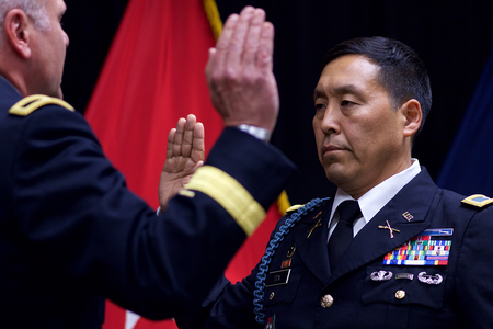 Alaska Army National Guard Col. Wayne Don, then 38th Troop Command commander, pledges the Oath of Office, administered by Alaska Army National Guard Brig. Gen. Joseph Streff, Alaska Army National Guard commander, after Don was promoted to full colonel. Dena'ina Center, Anchorage, July 14, 2017.  (U.S. Army photo by Sgt. David Bedard)