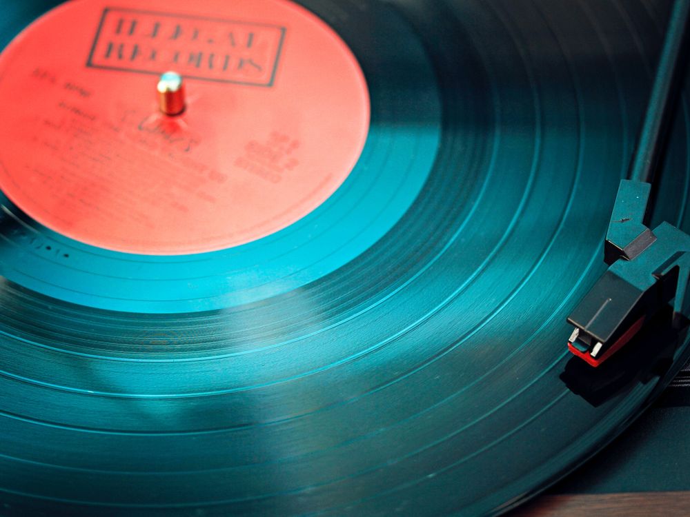 Close-up shot of vinyl record on record player