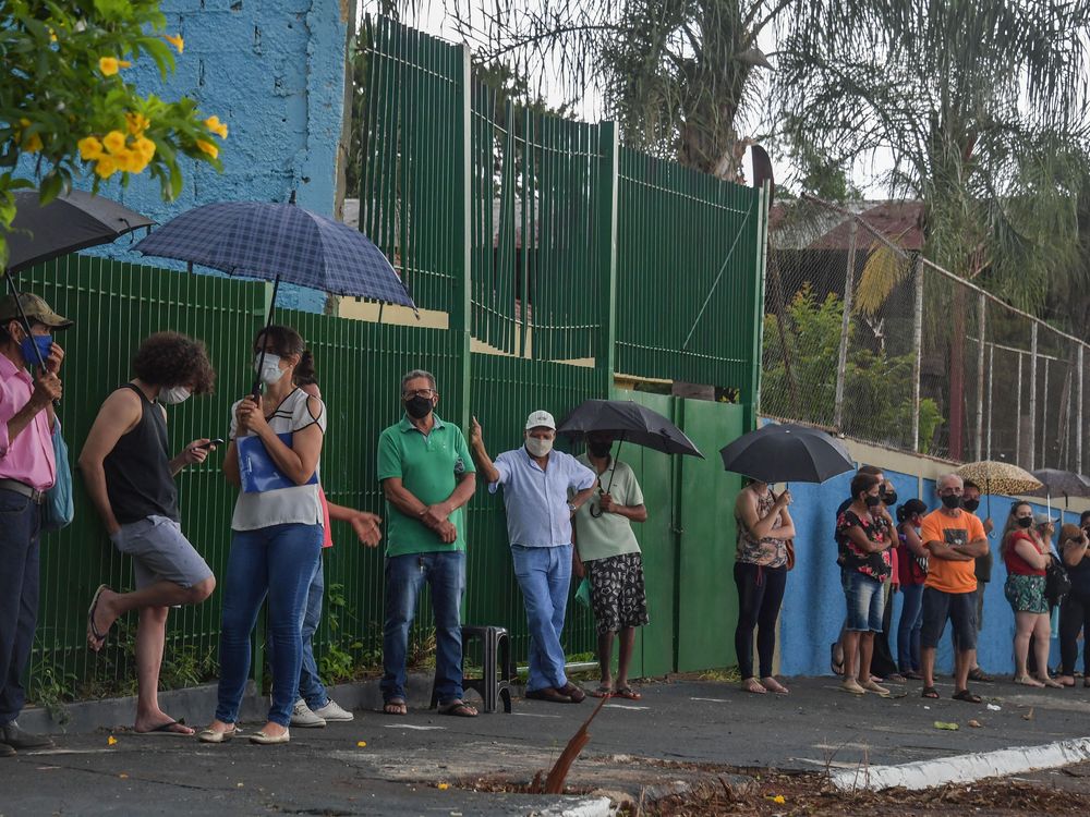 On February 17, 2021, residents line up to receive the Coronavac vaccine against COVID-19, in Serrana, about 323 km from Sao Paulo, Brazil.