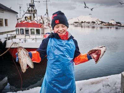 J&oslash;rgen Botolfsen, pictured in 2020 outside Ballstad Fisk AS, where he helps process cod. &ldquo;Bigger kids are stronger and faster,&rdquo; he says.