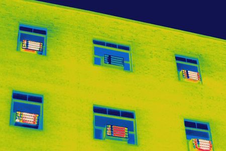 Thermal image of window mounted AC units in an apartment building.