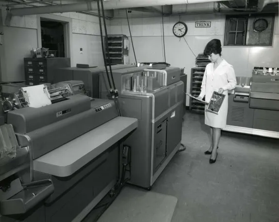 Woman with beehive working an IBM accounting machine, 1960s