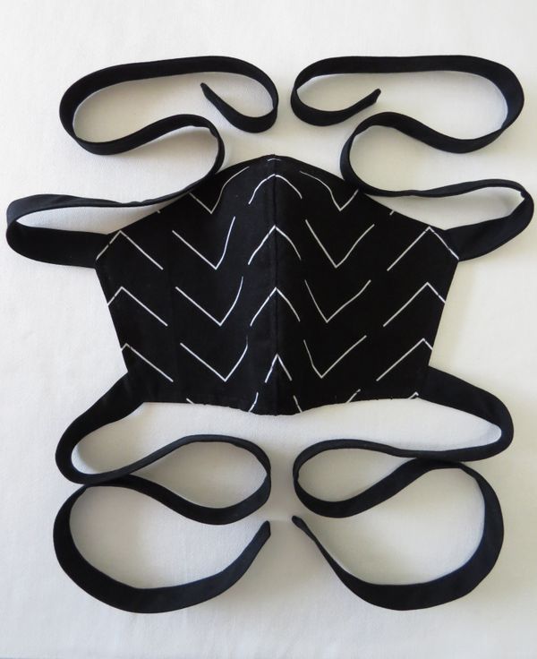 Black and white face mask with string ties. thumbnail