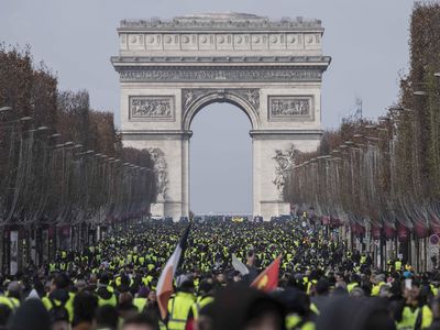 Thousands of yellow vest protesters seen in front of the Arc De Triomphe on December 8, 2018.
