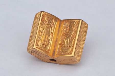 The ornate object features likenesses of Saints Leonard and Margaret, patron saints of childbirth.