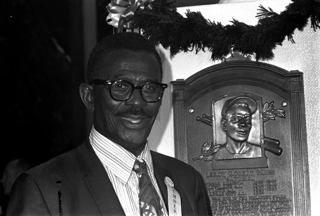 Satchel Paige next to Hall of Fame plaque