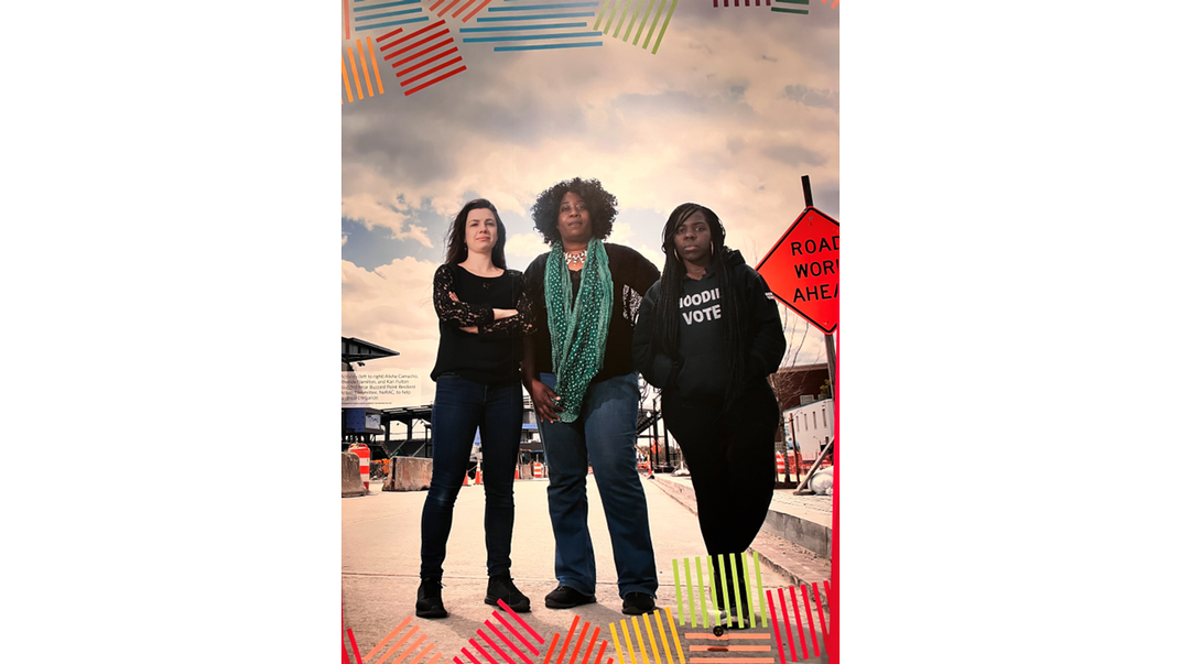 Full-length photo of three women standing on concrete pavement in what appears to be a construction zone in an industrial area. They are facing the camera, posing for a portrait. From left to right: Alicia Camancho is a white woman with dark, long hair.