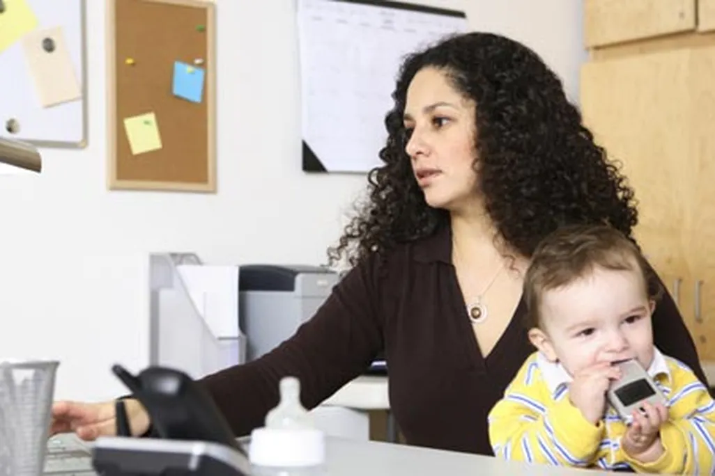 Woman at work with her child