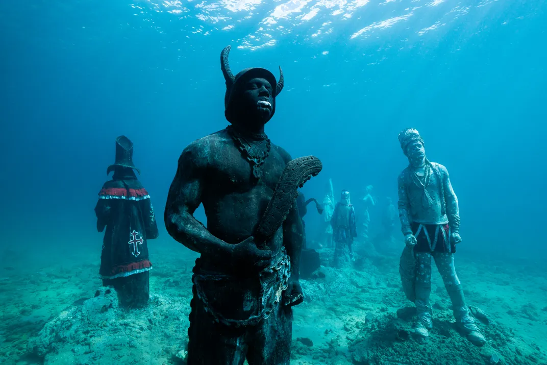 Underwater sculptures silhouetted
