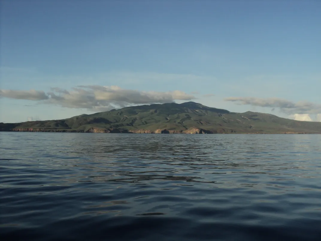 a small island with foreground of water