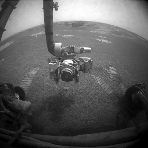 The Spirit and Opportunity rovers wait out a summer storm.