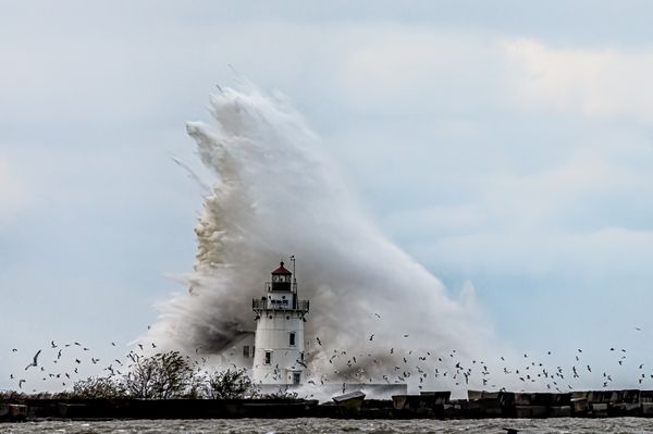 Massive wave breaking over Lake Erie Lighthouse. thumbnail