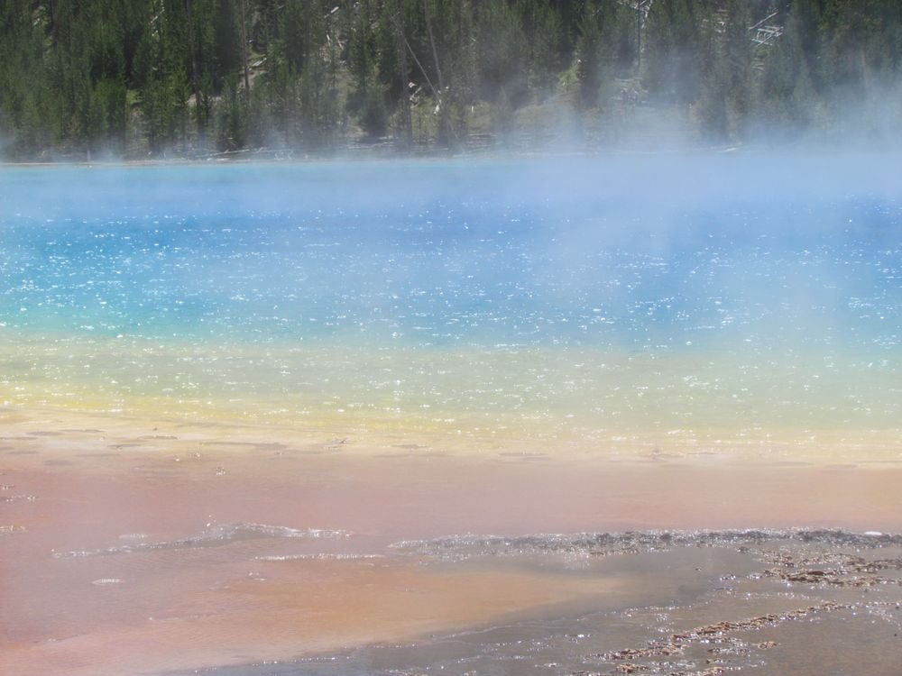 The wind made the steam rise up from the Grand Prismatic Spring in  Yellowstone National Park. In between the wind gusts, this rainbow of water  colors appeared., Smithsonian Photo Contest