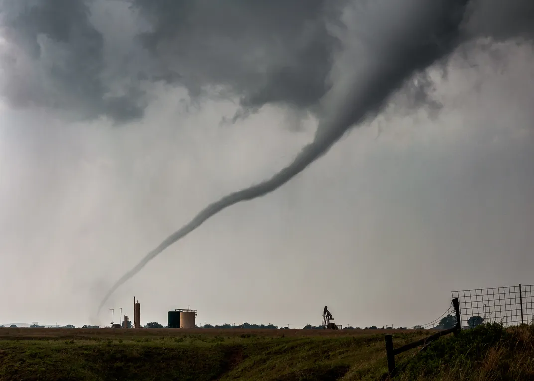 In the heart of America's tornado alley, a menacing, ropeshaped funnel