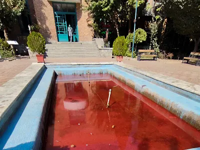Outisde of the Artists Forum at Tehran&#39;s Honarmandan Park, an anonymous activist dyed a fountain blood red.