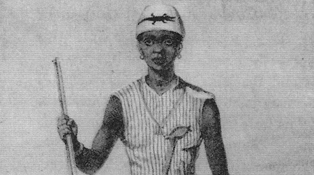 One of Dahomeys' women warriors, with a musket, club, dagger—and her enemy's severed head.