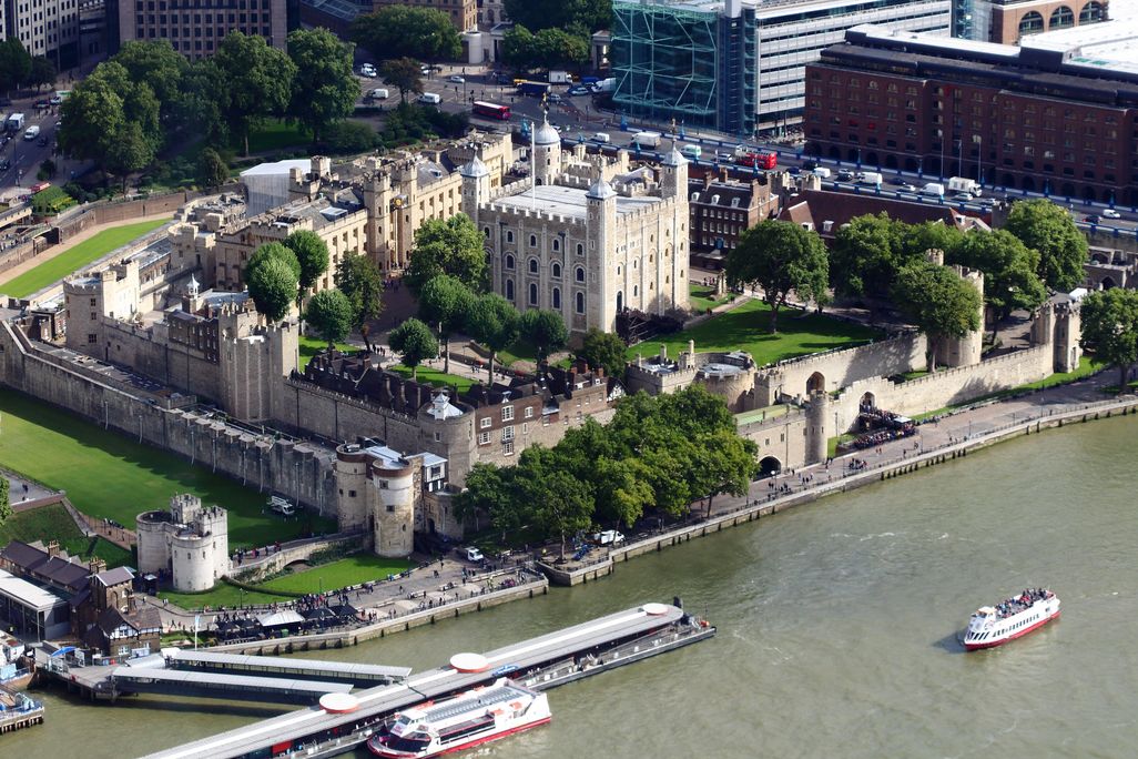 An overview of a large fortress next to a body of water