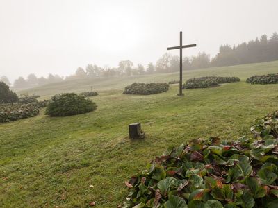 A cross marks the death of the 340 murdered villagers of Lidice.