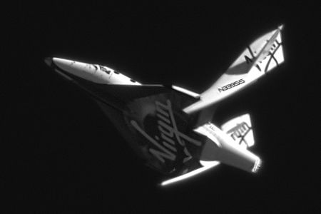 SpaceShipTwo shows its characteristic “wing feathering” in a gliding test over Mojave, California in May 2011. 