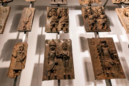 Some of the hundreds of brass plaques taken from Benin City in 1897 now held by the British Museum